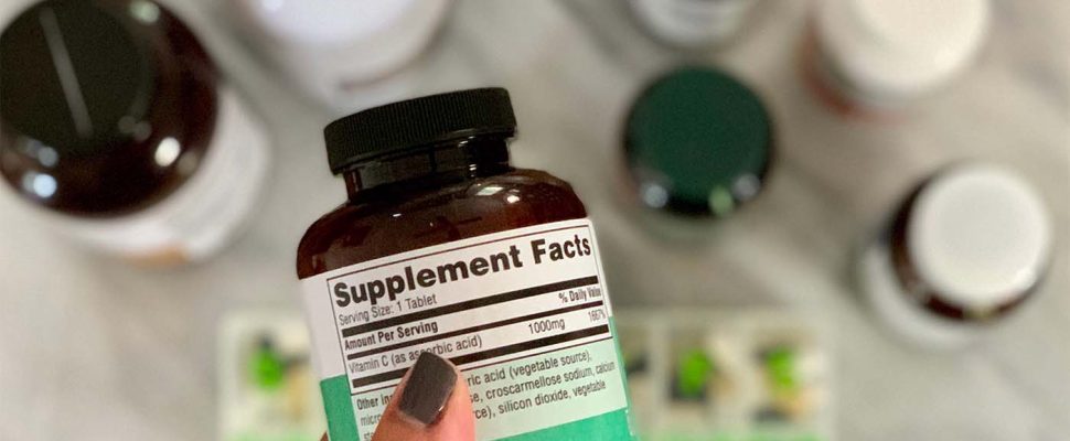 reading-the-label-on-supplement-pill-bottle-2021-09-01-12-54-07-utc